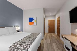 Ein Bett oder Betten in einem Zimmer der Unterkunft Microtel Inn and Suites - Zephyrhills