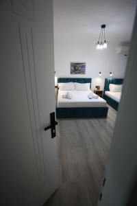Postel nebo postele na pokoji v ubytování VILA ALIZEE Hotel