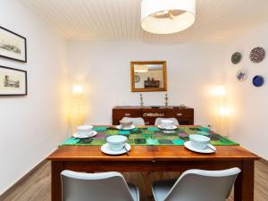 a dining room with a table and chairs at Holiday Home Cap de Tossa by Interhome in Tossa de Mar