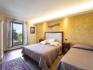 A bed or beds in a room at Holiday Home La Smarrita Dei Carradori by Interhome