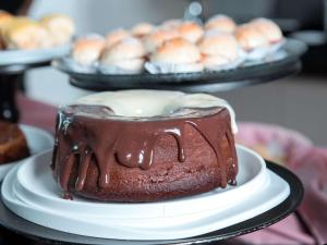 a chocolate cake on a plate on a table at ibis Presidente Prudente Manoel Goulart in Presidente Prudente