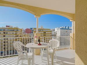a white table and chairs on a balcony with a view at Apartment Apolo VII-7 by Interhome in Calpe
