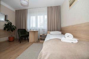 Posteľ alebo postele v izbe v ubytovaní Hotel Polonia