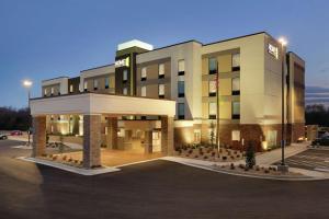 a rendering of a hotel with a parking lot at Home2 Suites by Hilton Fort Smith in Fort Smith