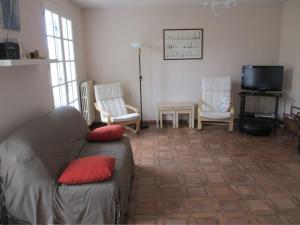 a living room with a couch and two chairs at Villa proche plage et centre - V06205 in Soulac-sur-Mer