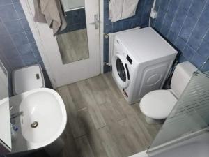 a bathroom with a white toilet and a sink at Magnifique studio cœur de Nice in Nice
