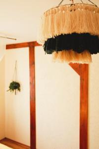 a hat hanging from the ceiling of a room at Apartament ZAMURNA 4 in Golub-Dobrzyń