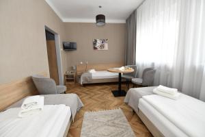 Posteľ alebo postele v izbe v ubytovaní Hotel Polonia
