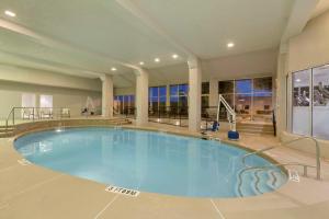 a large swimming pool in the middle of a building at Embassy Suites by Hilton El Paso in El Paso