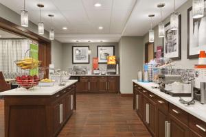 a kitchen with a counter with fruits on it at Hampton Inn Penn Yan, NY in Penn Yan