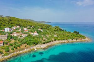 an aerial view of a small island in the ocean at Villa Dee in Lukoran