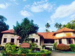 a building with a sign in front of it at Grand Colonial Viveka in Kurunegala