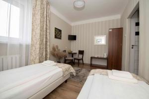 Posteľ alebo postele v izbe v ubytovaní Hotel Polonia
