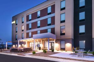 a rendering of a hotel building at night at Home2 Suites By Hilton Merrillville in Merrillville