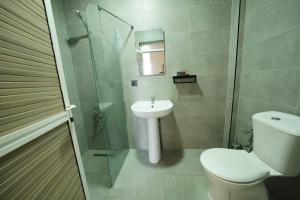 a bathroom with a toilet and a sink and a shower at Chillos Beach in Marmaris