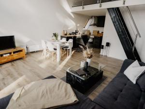 a living room with a couch and a table at Holiday Home Hexenhaus im Harz by Interhome in Clausthal-Zellerfeld