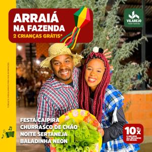 Un uomo e una donna sono sulla copertina di una rivista di Hotel Fazenda Vilarejo All Inclusive a Conservatória