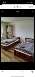 Postel nebo postele na pokoji v ubytování Rodinný dům Oldřichovice