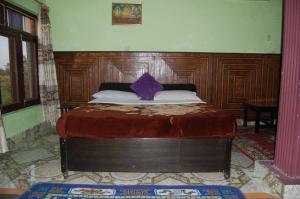 Rúm í herbergi á Siddhartha Guest House