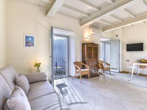 a living room with a couch and a table at Apartment Sant'Agabito by Interhome in Marciana