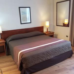 Postel nebo postele na pokoji v ubytování Hotel Alcala del Rio