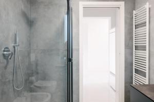 a shower with a glass door in a bathroom at Lara’s House in San Giovanni Lupatoto