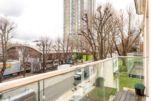 a view of a city street from a balcony at Tranquil Belsize Park Haven with Stunning Views in London