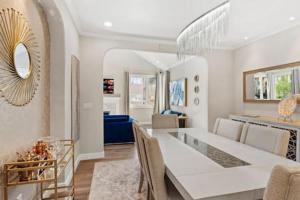 a living room with a table and a dining room at Champagne Taste Luxury Home in Hillcrest in San Diego