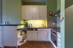 Virtuvė arba virtuvėlė apgyvendinimo įstaigoje Uthlande-Strandhafer