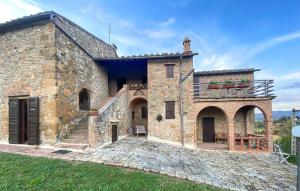 an external view of a stone building with a patio at Lovely Apartment In Volterra With Wifi in Volterra