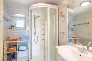 a bathroom with a shower and a sink at Holiday house Villa Marija, Pinezici in Krk +21 photos
