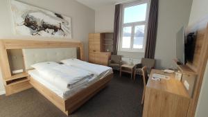 Postel nebo postele na pokoji v ubytování Hotel An der Altstadt