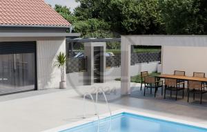 eine Terrasse mit einem Tisch und einem Pool in der Unterkunft Nice Home In Paljuv With Wi-fi in Paljuv