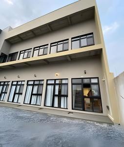 a rendering of a house with large windows at Lofts Meia Morada SFS in São Francisco do Sul