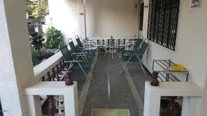 a room with chairs and tables in a building at Santarem uri del flu in Iloilo City