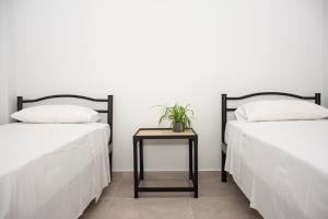 A bed or beds in a room at Christina Apartment