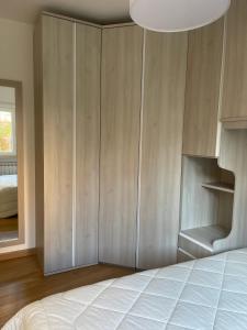 a bedroom with a bed and a large closet at Villa Rosanna - Castel di Sangro in Castel di Sangro