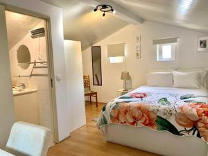 a bedroom with a bed and a bathroom at Central Avenida Liberdade 2 in Lisbon