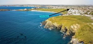 an aerial view of a island in the ocean at Fistral Studio in Newquay