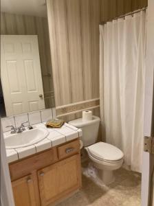 a bathroom with a toilet and a sink and a shower at Home sweet home in Hillsboro