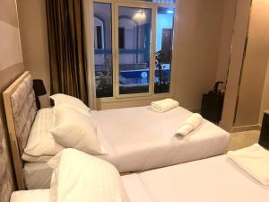 Letto o letti in una camera di Pyramids Nun INN