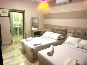Letto o letti in una camera di Pyramids Nun INN
