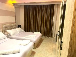 Letto o letti in una camera di Pyramids Nun INN