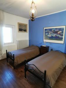 A bed or beds in a room at Agriturismo Le Spezie