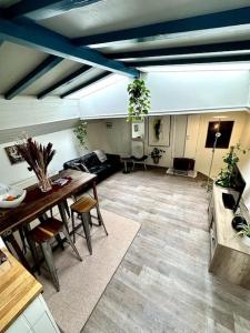 a living room with a table and a couch at Houseboat in Amsterdam in Amsterdam