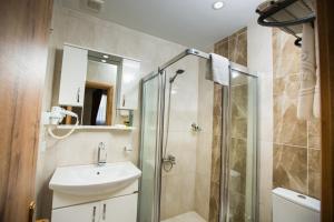 a bathroom with a sink and a shower at OLD CITY HOSTEL in Istanbul