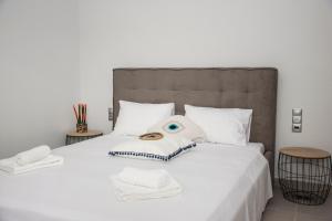 A bed or beds in a room at Christina Apartment
