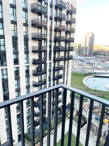 a balcony view of a large apartment building at Perfect flat next to Wembley Stadium in London