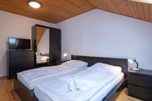 Ein Bett oder Betten in einem Zimmer der Unterkunft Vila 27