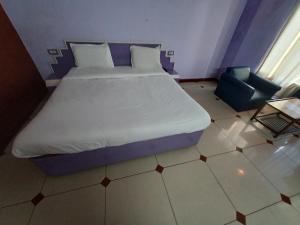 Postel nebo postele na pokoji v ubytování Hotel Maya international